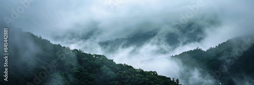 Mystical Mountains Capture mystical atmosphere of mountain landscapes shrouded in mist and fog evoking a sense of wonder and enchantment