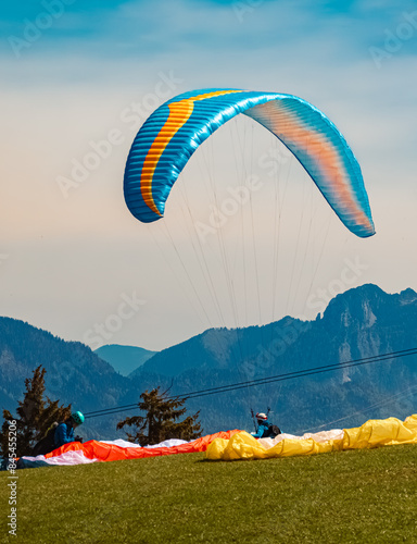 Alpine summer view with a paraglider taking off at Koessen, Kitzbuehel, Tyrol, Austria photo