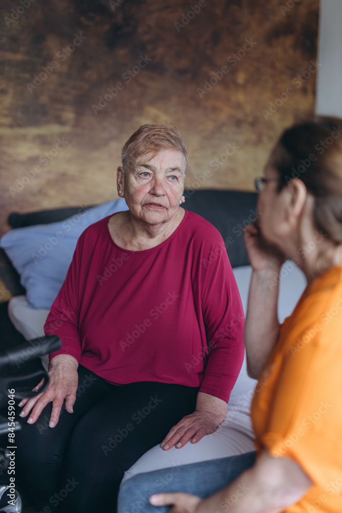 A social worker talks to a lonely old woman.Loneliness of elderly people A social worker talks to a lonely old woman.Loneliness of elderly people