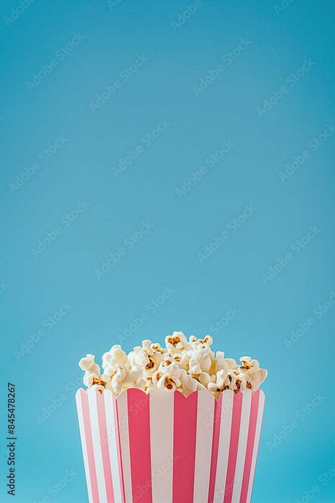 Popcorn in a bucket on white background. Copy space. Minimal concept. 