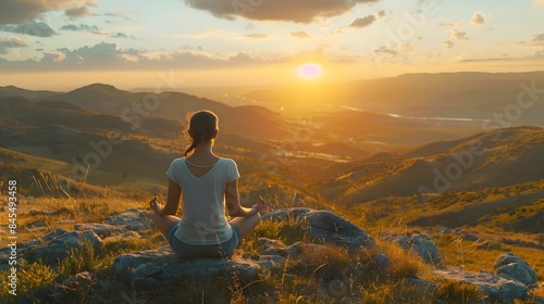 Tranquil Yoga Session on a Mountain Top at Sunrise Overlooking a Serene Valley