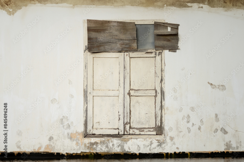 old wooden window and cement wall old wooden window and cement wall