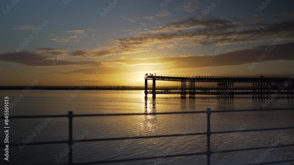 Historical Pier of Huelva Spain during Sunset with tourists Historical Pier of Huelva Spain during Sunset with tourists