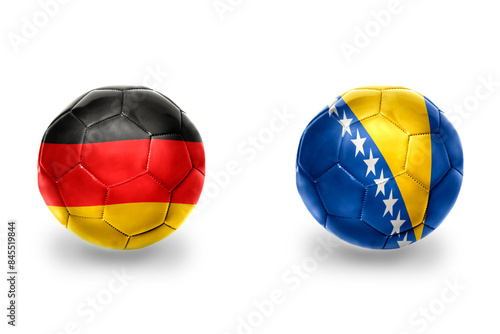 football balls with national flags of germany and bosnia and herzegovina ,soccer teams. on the white background.