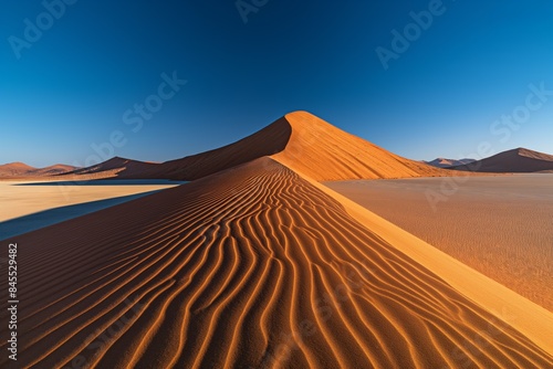 An arid desert landscape with towering dunes under a hot sun  offering a stunning arid scenery