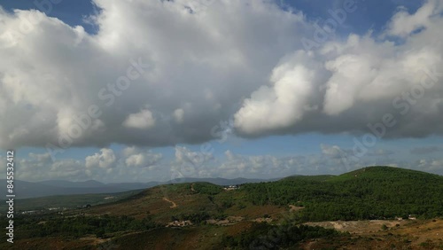 Aerial view over mountains under cloudy sky in summer day in Urla ,cesmealti, izmir. High quality 4k footage photo