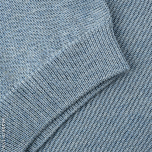 Elastic band close up on the sleeve of a light blue-gray knitted cotton polo t-shirt