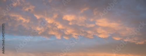 sunset sky background with mammatus clouds yellow and grey photo