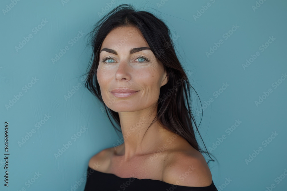 A close up portrait of a woman with a subtle smile A close up portrait of a woman with a subtle smile