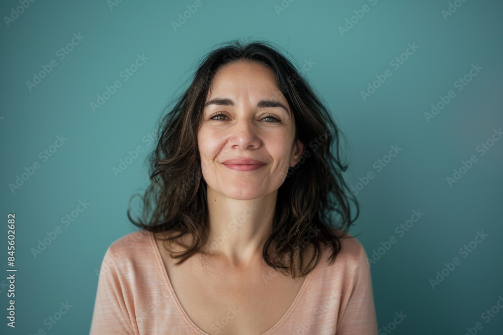 A close up portrait of a woman with a subtle smile A close up portrait of a woman with a subtle smile