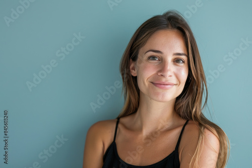 A close up portrait of a woman with a subtle smile