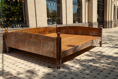 Traditional Uzbek wooden trestle bed photo