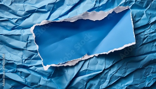 Wallpaper Mural Blank blue crumpled torn paper piece on wrinkled blue paper background. Small horizontal ripped paper sheet with copy space. Top view  Torontodigital.ca