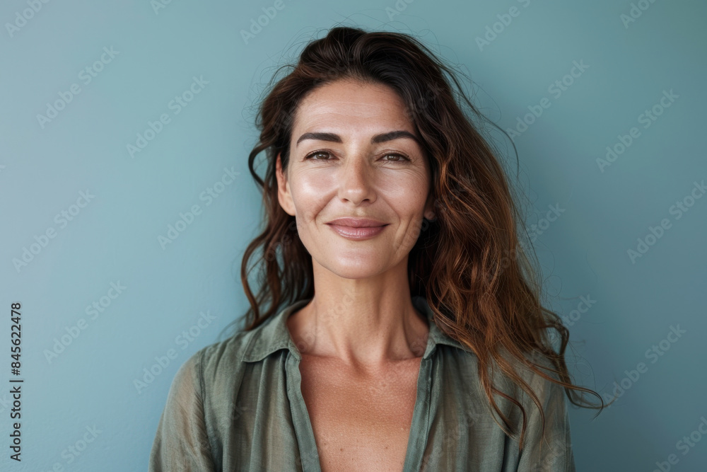A close up portrait of a woman with a subtle smile A close up portrait of a woman with a subtle smile