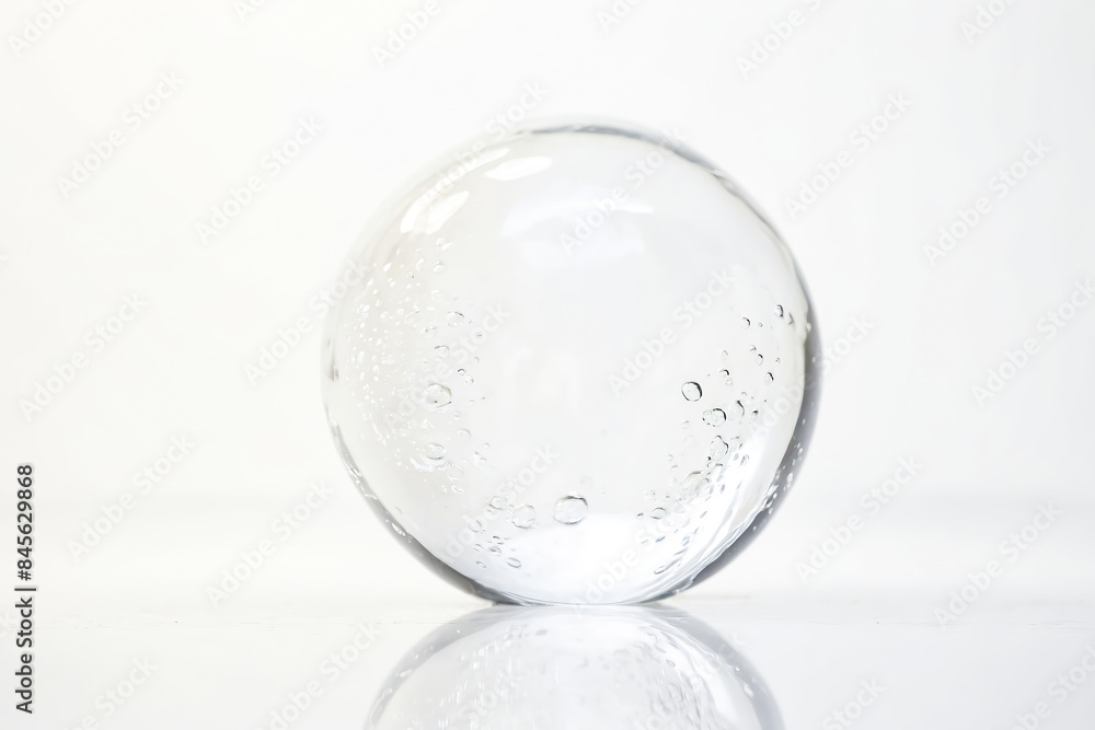 Transparent sphere with bubbles, reflecting on white background Transparent sphere with bubbles, reflecting on white background