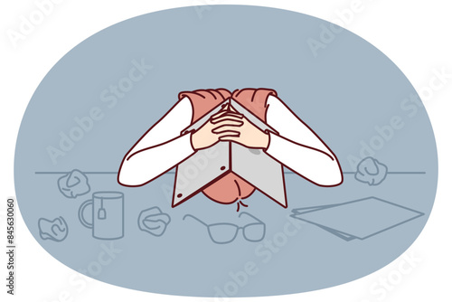 Tired female office worker hiding head under laptop suffering from stress and burnout or overwork. Business woman with problems due to burnout and loss of income needs help of crisis manager
