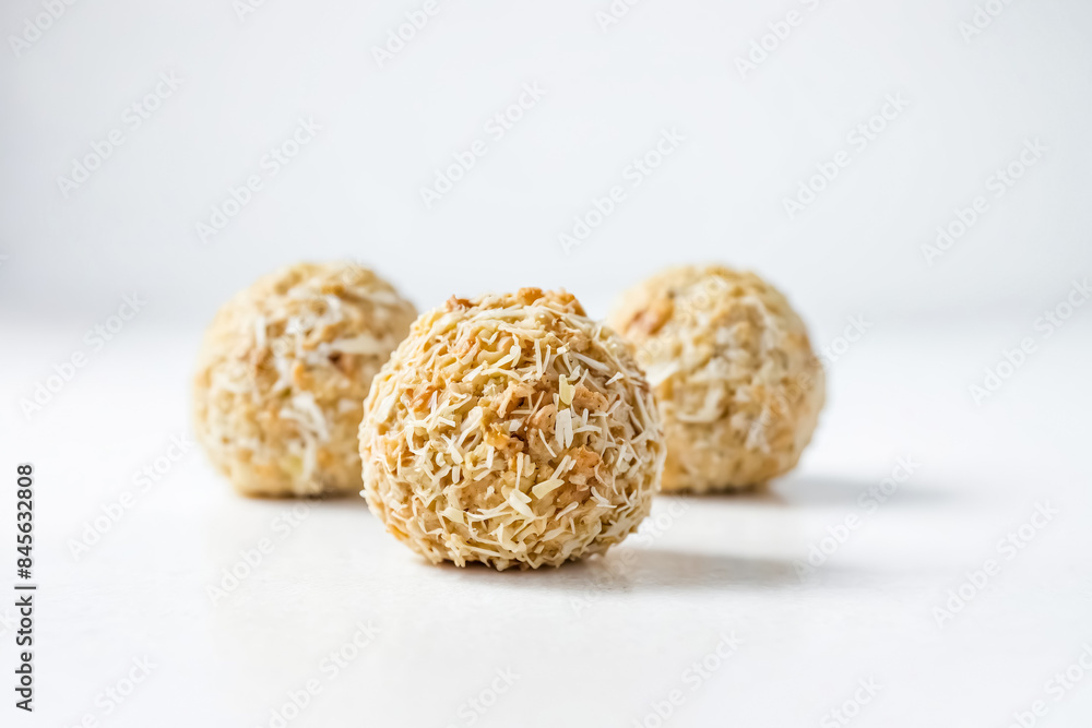 Close-up of Three Coconut Balls on White Background Close-up of Three Coconut Balls on White Background
