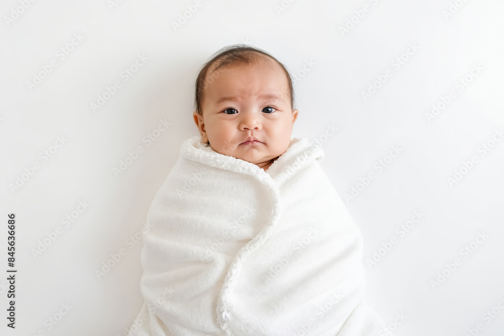 Adorable Baby Wrapped in a White Blanket Adorable Baby Wrapped in a White Blanket