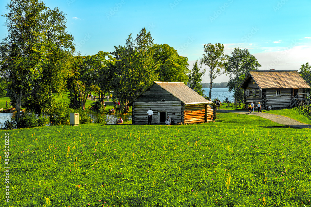 Fototapeta premium Landscape on the island of Kizhi with the buildings of the mill and a residential building
