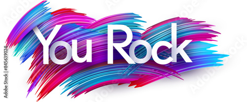 You rock paper word sign with colorful spectrum paint brush strokes over white.