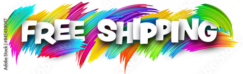 Free shipping paper word sign with colorful spectrum paint brush strokes over white.