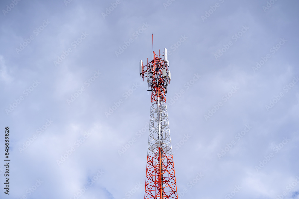 Signal tower or Mobile phone tower .Global connection and internet network concept.on blue sky. Signal tower or Mobile phone tower .Global connection and internet network concept.on blue sky.