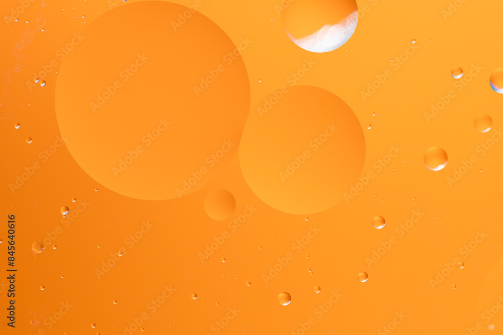 Abstract background with large and small circular shapes in orange. Abstract background with large and small circular shapes in orange.