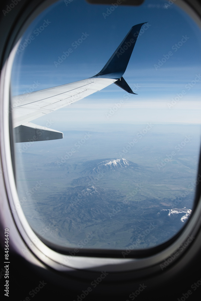 View of the mountains over the western USA, with airplanes wing in the view. View of the mountains over the western USA, with airplanes wing in the view.