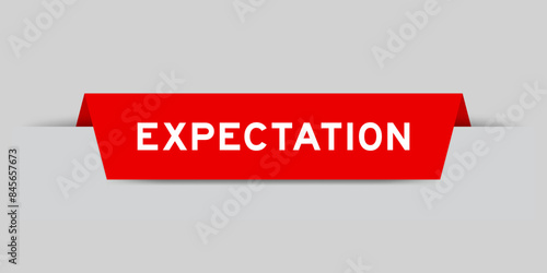 Red color inserted label with word expectation on gray background