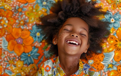 Happy Young Girl Lying On A Floral Blanket