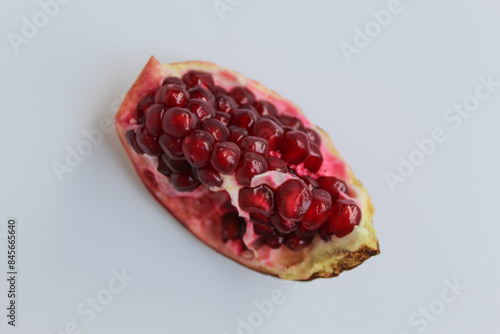 Bild auf Leinwand Inside of pomegranate fruit, fresh red seeds, isolated on white background