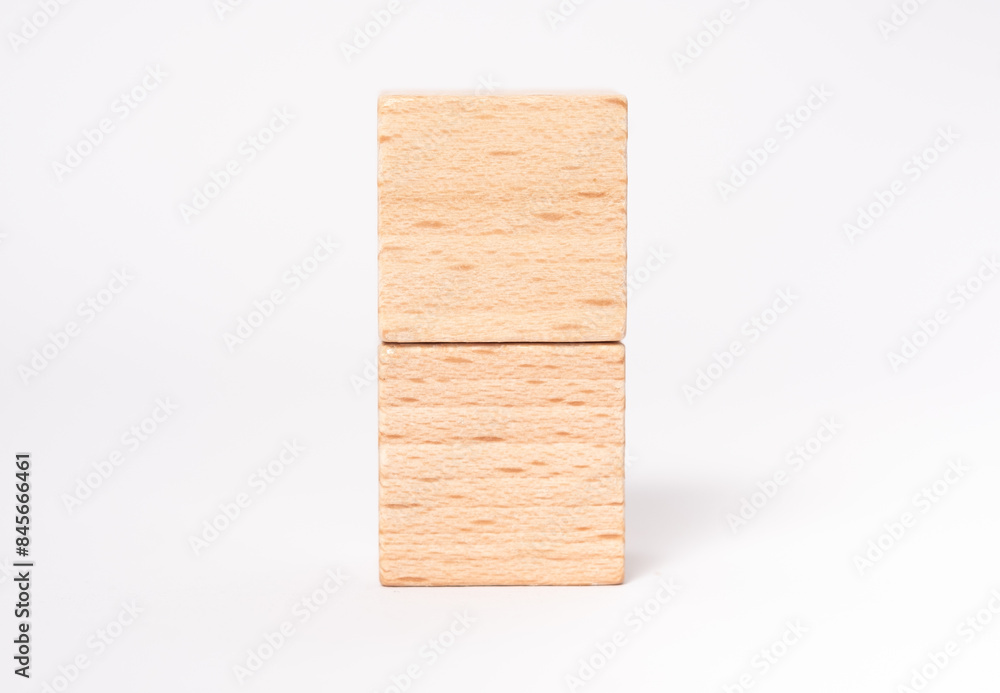 Two empty wooden cubes with place for letters