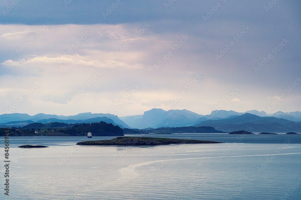 The spactacular Norwegian coastline, near stavanger, early on a spring morning. Mountains are disappearing into the distance. The spactacular Norwegian coastline, near stavanger, early on a spring morning. Mountains are disappearing into the distance.