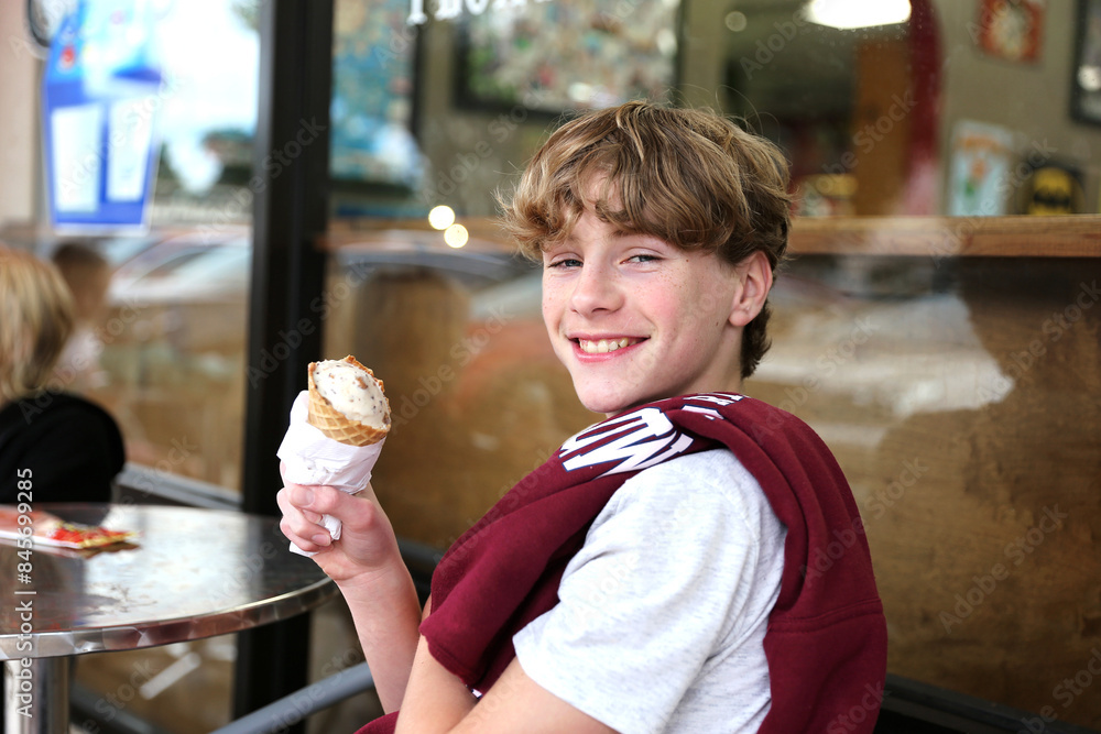 Happy Kids Eating Ice Cream Outside at Sweet Shop Restaurant Happy Kids Eating Ice Cream Outside at Sweet Shop Restaurant