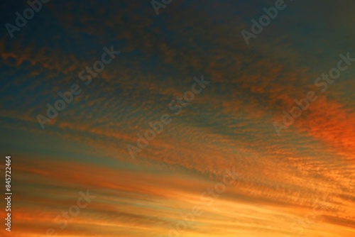 Orange and blue sky during sunset with clouds