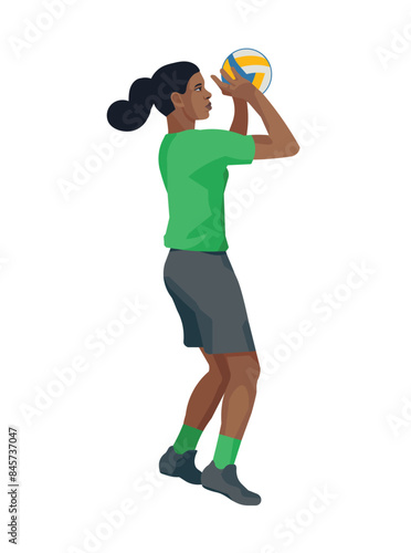 Black women's volleyball girl player in a green T-shirt jumps up to push the ball with two hands