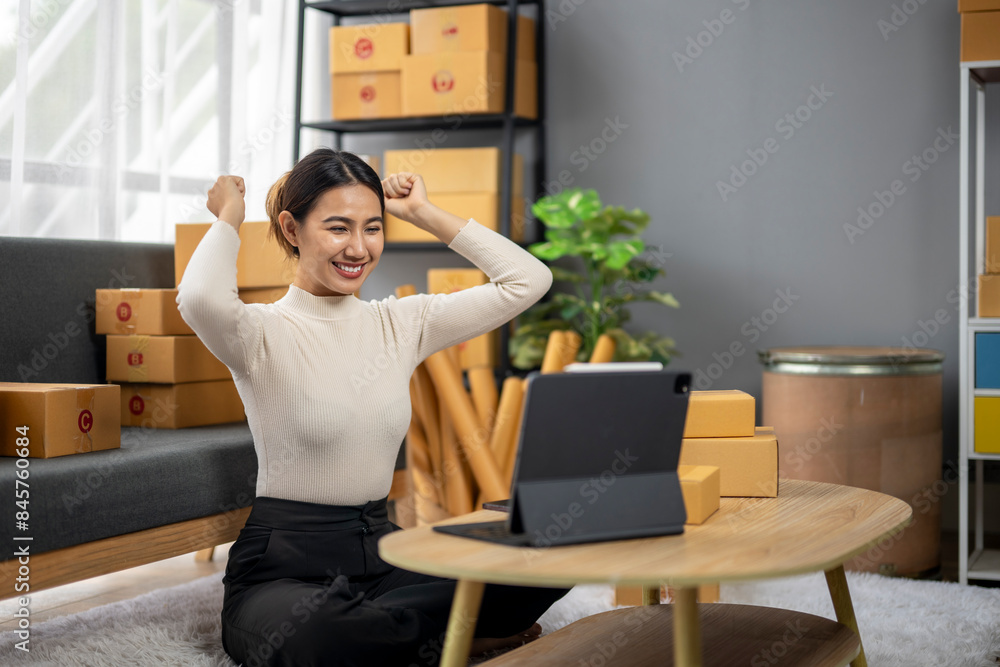 She is holding her hands up in the air and smiling She is holding her hands up in the air and smiling