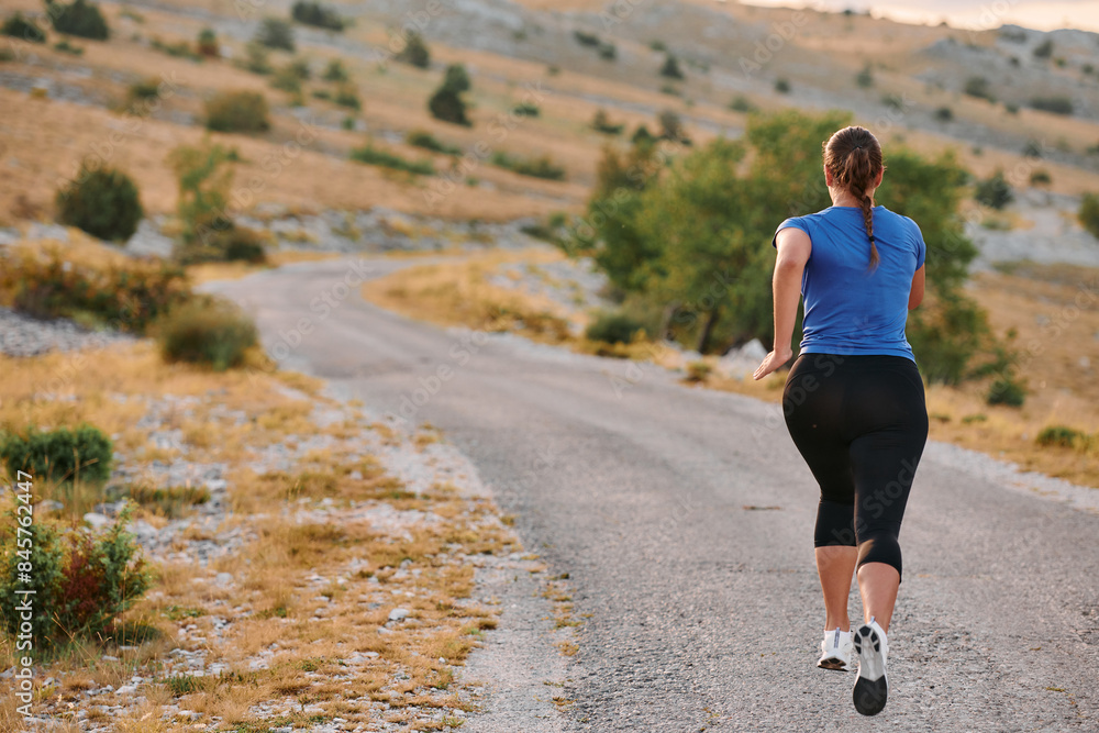 Empowered Runner Embracing Nature's Beauty on a Serene Morning Trail. Empowered Runner Embracing Nature's Beauty on a Serene Morning Trail.