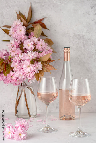 Drink photography of rose wine; wine; pink; wineglass; bottle; vintage; retro; cherry blossom; blooming; flower; spring; summer; winery; drink; background; celebration; romance; bar;