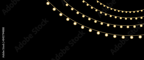 Christmas or garland festive hanging glowing bulbs or lights isolated on black back background.
