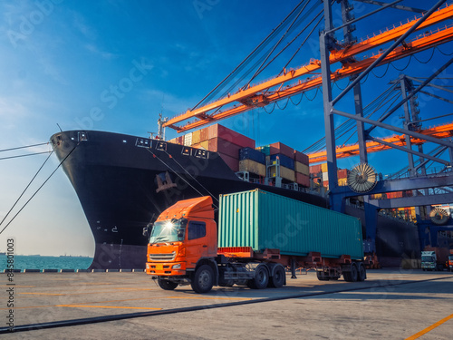 The container vessel during discharging at an industrial port and move containers