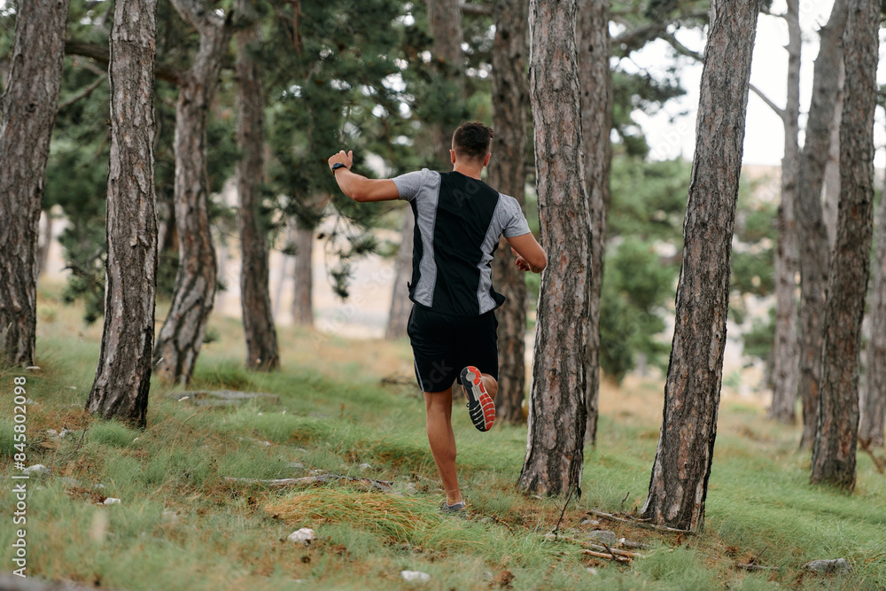 Determined Man Conquering Forest Obstacles with Grit and Speed Determined Man Conquering Forest Obstacles with Grit and Speed