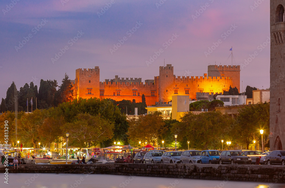Evening view of Grand Masters Palace illuminated in warm light in Rhodes, Greece