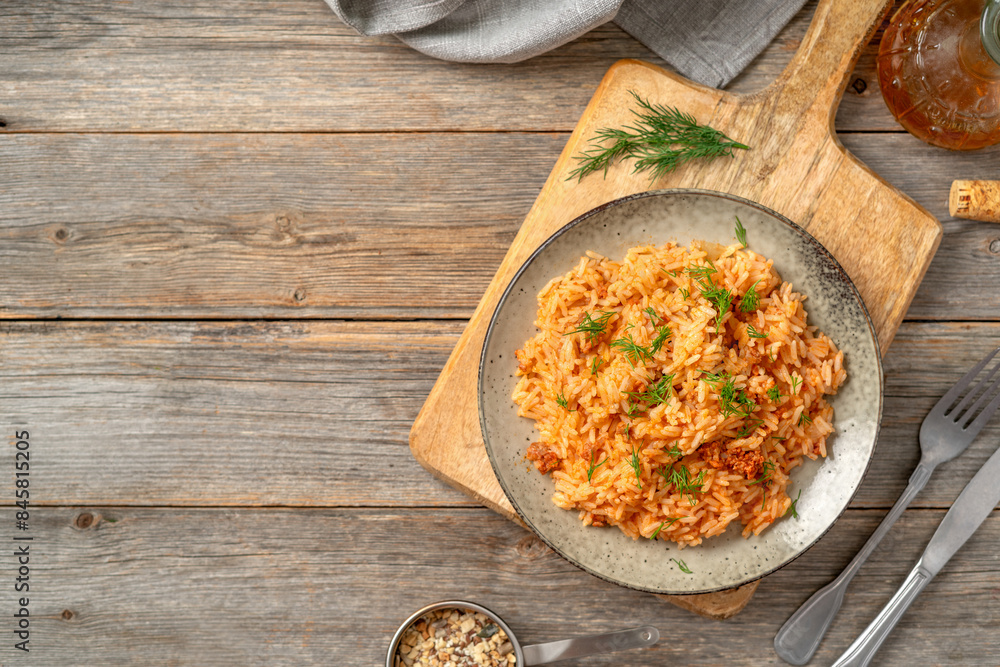 Rice with minced beef in tomato sauce in a plate. Top view from the copyspace
