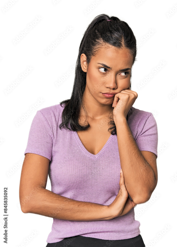 Young Filipina woman who feels sad and pensive, looking at copy space. Young Filipina woman who feels sad and pensive, looking at copy space.
