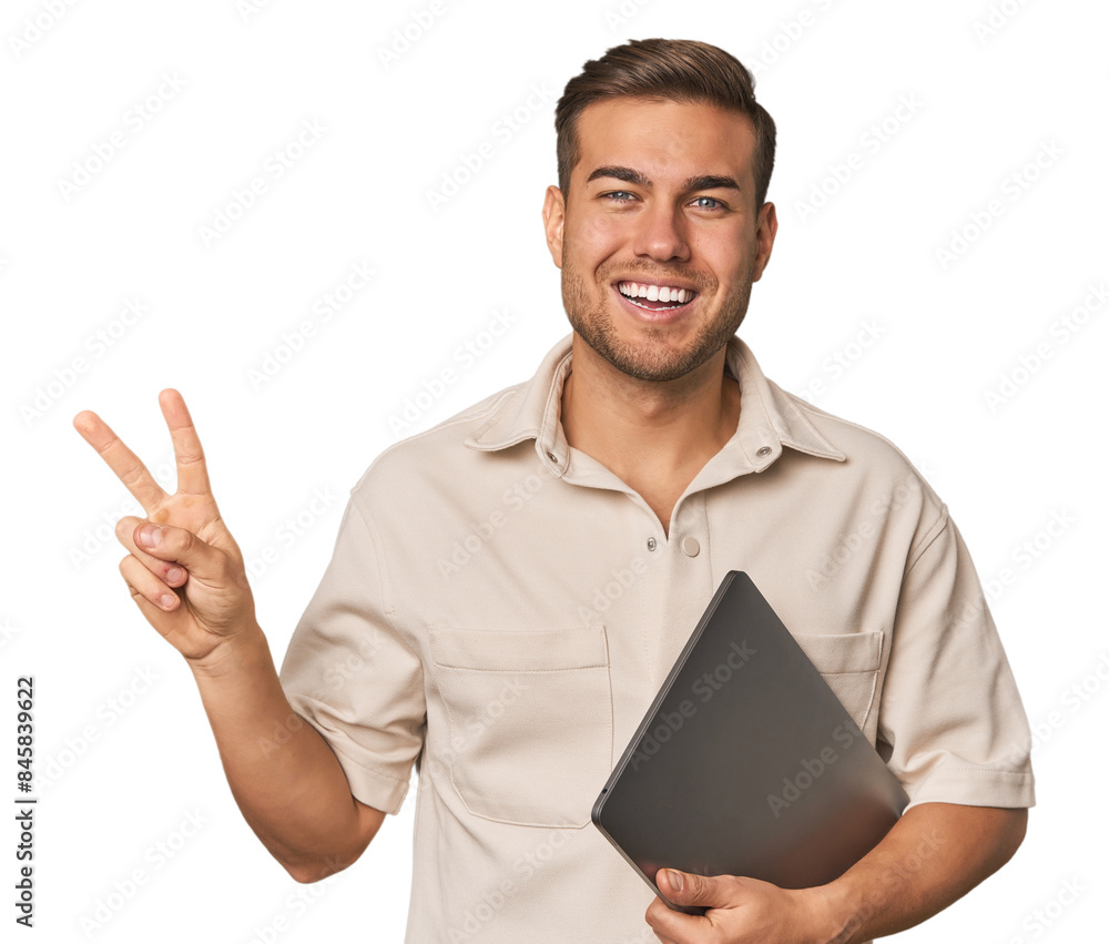 Man holding laptop, studio joyful and carefree showing a peace symbol with fingers. Man holding laptop, studio joyful and carefree showing a peace symbol with fingers.