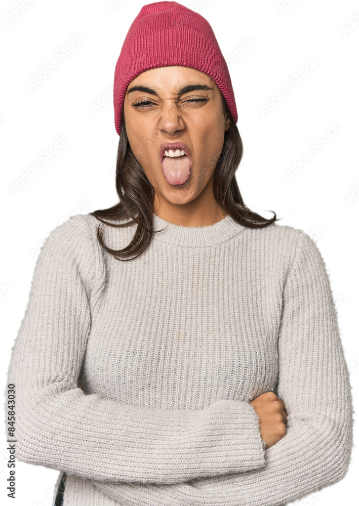 Hispanic young woman funny and friendly sticking out tongue. Hispanic young woman funny and friendly sticking out tongue.