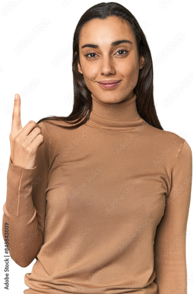 Hispanic young woman pointing with finger at you as if inviting come closer. Hispanic young woman pointing with finger at you as if inviting come closer.