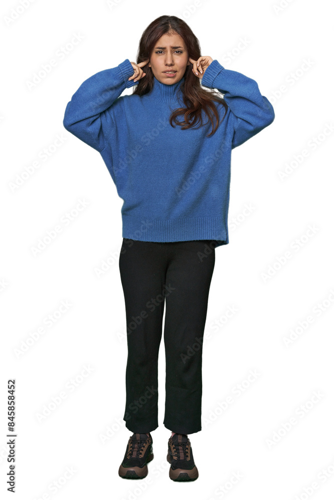 Middle Eastern woman, full body studio covering ears with fingers, stressed and desperate by a loudly ambient. Middle Eastern woman, full body studio covering ears with fingers, stressed and desperate by a loudly ambient.
