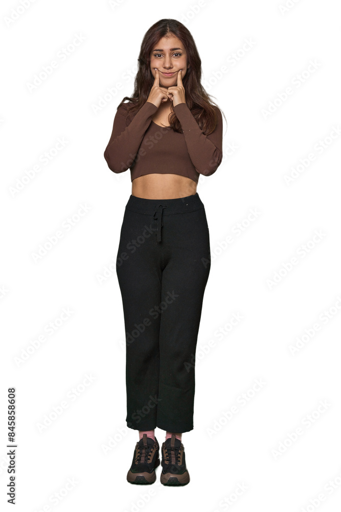 Middle Eastern woman, full body studio doubting between two options. Middle Eastern woman, full body studio doubting between two options.